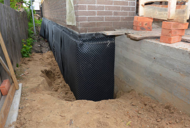 Happy homeowners after waterproofing job in Suamico